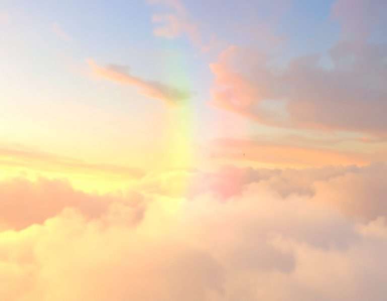 Pastel sunset sky with soft pink and gold clouds